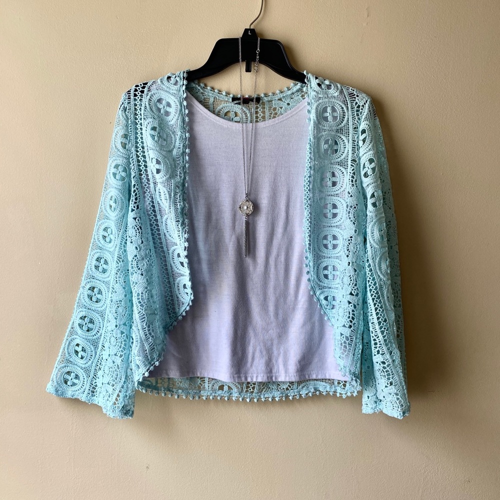 Blouse with tank top underneath and necklace